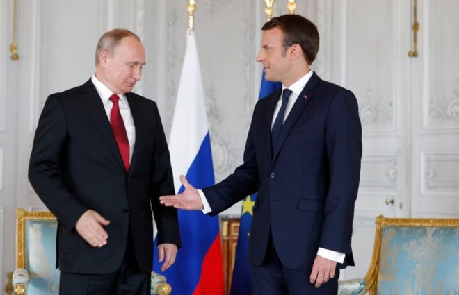 Mr Macron (right) believes it is essential to talk to Russia