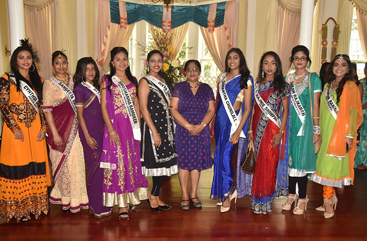 The delegates share a moment with Mrs. Nagamootoo after being told to be more than just beautiful. They were told to be professionals and not just strive to be beautiful (Adrian Narine photo)