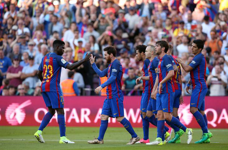 Barcelona's players celebrate a goal. REUTERS/Albert Gea