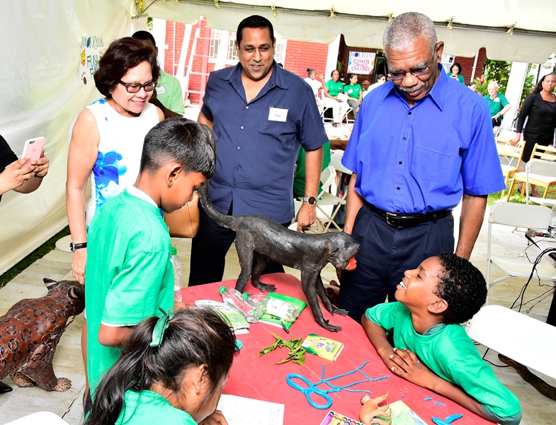 President David Granger, First Lady Mrs. Sandra Granger and Iwokrama’s Chief Executive Officer (CEO), Mr. Dane Gobin looking at some of the artwork created by the children