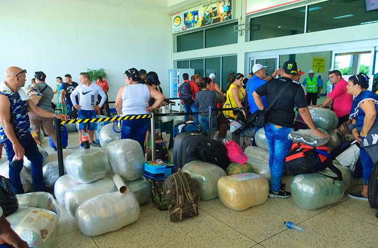 EasySky passengers prepare to check-in at the Cheddi Jagan International Airport (CJIA) last Friday