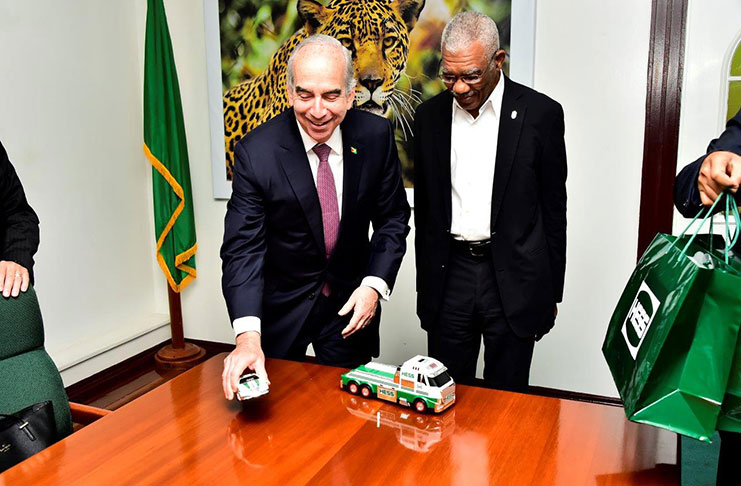 Chief Executive Officer (CEO) of HESS Corporation, John Hess presented President David Granger with two HESS model vehicles.(Ministry of the Presidency photo)