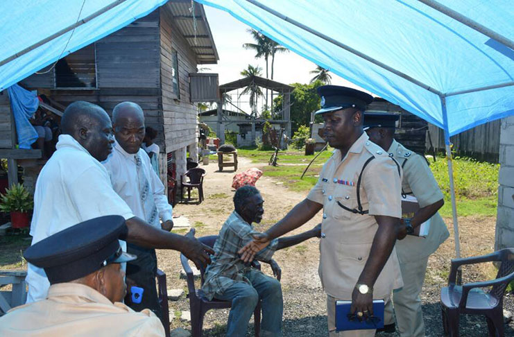 Superintendent Linden Isles and Commander James and other ranks meeting the relatives of Clinton Walkes