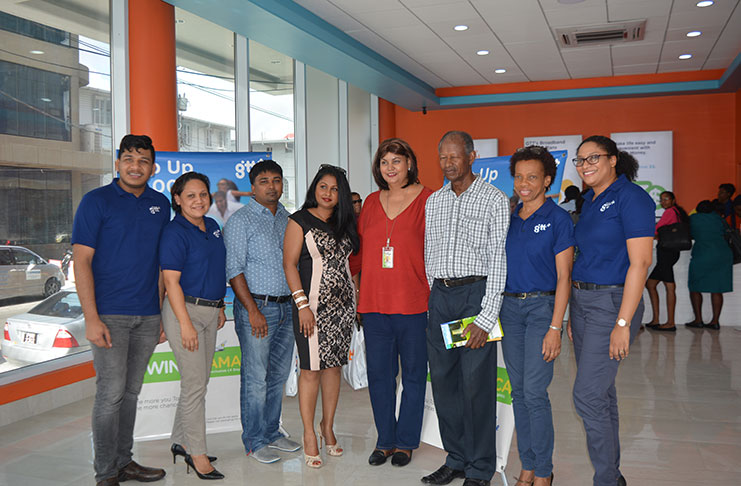 GTT Public Relations Officer Nadia Deabreu (second left), company representatives and Fly Jamaica’s Commercial Relations Officer Patricia Lewis (fifth left) with the winners Hardat Malchand, Vanita Ally and Clement Sealey