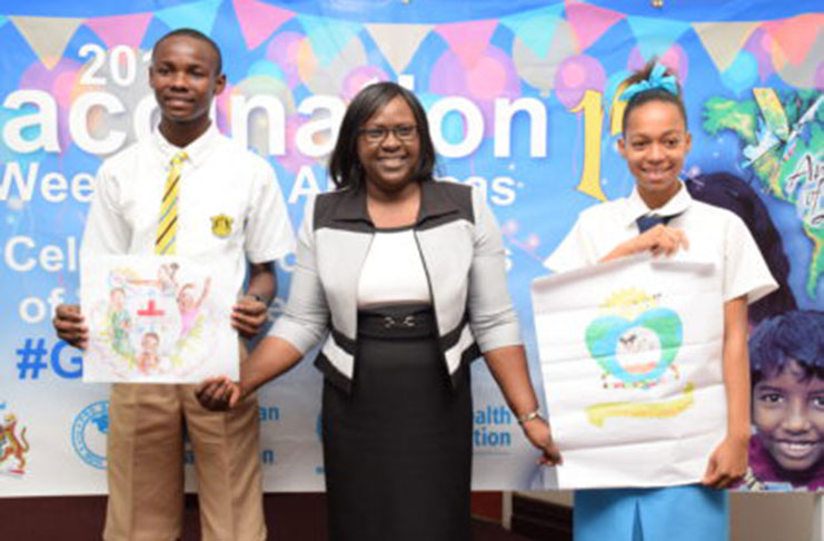 Minister within the Ministry of Public Health, Dr Karen Cummings with winners of the Visual Arts competition in the 14-16 years category