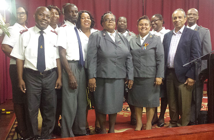 (second and third from left: Outgoing Divisional Commanders, Emmerson and Carolinda Cumberbatch
with officers of the Guyana Division of the Salvation Army during their farewell service at Citadel H.Q. on
Sunday. Second from right is Chairman of the Advisory Board, Mr. Edward Boyer.