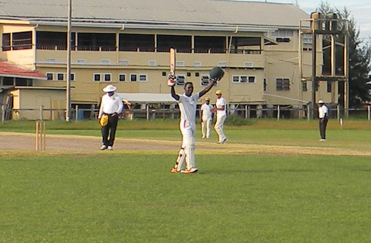 Kelon Anderson celebrates his century at the Police Sports Club ground.