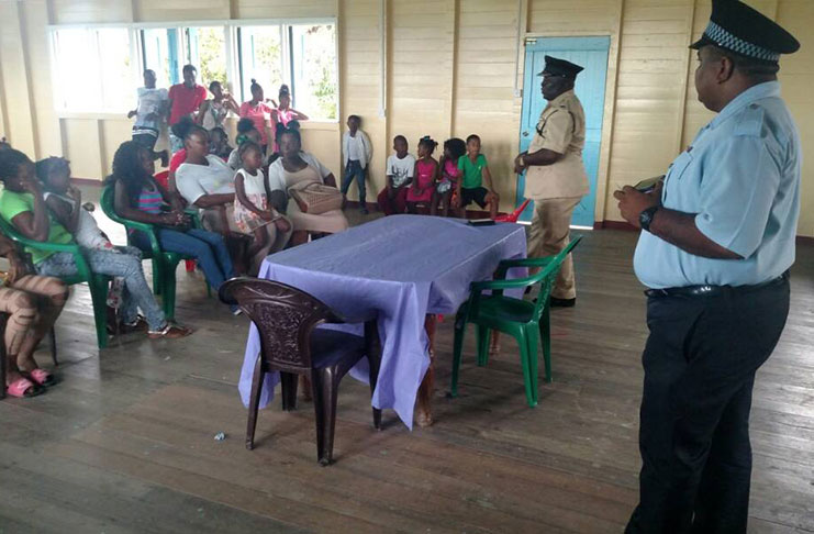 Commander Mansell and a junior rank during the sensitisation session held at the Dartmouth Community Centre.
