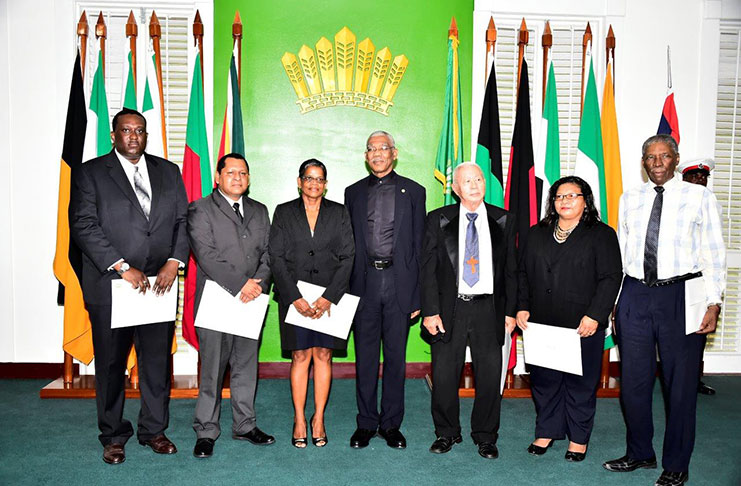 President David Granger with members of the Land Rights Commission which was sworn in on March 10, 2017  