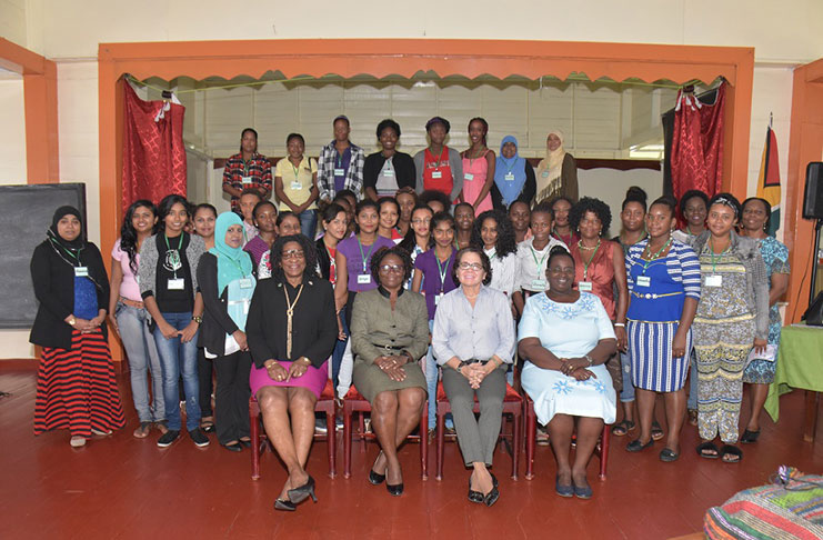 First Lady, Mrs. Sandra Granger, (seated third from left) is flanked by from left to right, Lieutenant Colonel (ret’d) Yvonne Smith, Facilitator of the workshop, Paulette Bollers and Co-Facilitator, Ninian Blair. The participants are pictured standing