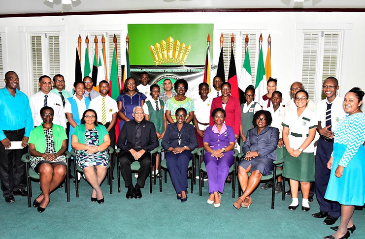 President David Granger and Minister of Education, Nicolette Henry, with the headteachers and students of the schools that benefited from NEST programme