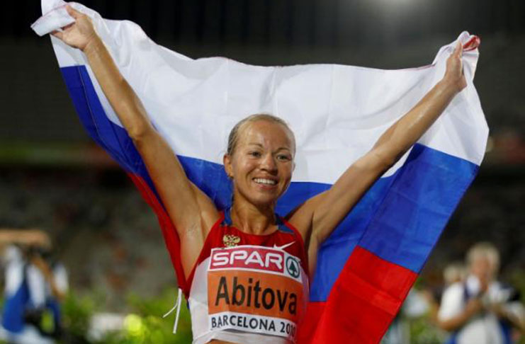 Inga Abitova of Russia celebrates after winning the silver medal in the women's 10 000 metres final at the European Athletics Championships in Barcelona July 28, 2010. (REUTERS/Sergio Perez/File Photo)
