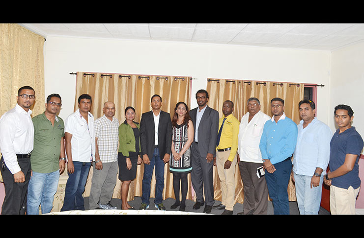 (Centre) Assistant Treasurer Natasha Mahadeo flanked by (left), President Radesh Rameshwar and (right), Vice-President Haleem Khan and other elected officials.