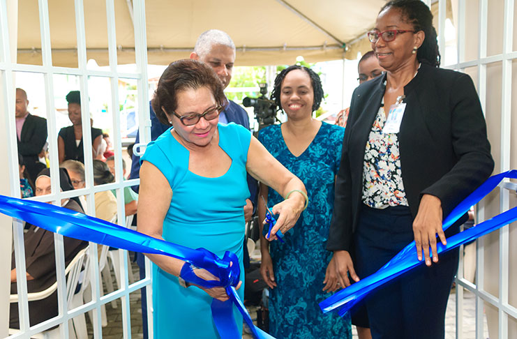 First Lady Sandra Granger cuts the ceremonial ribbon to open the Mercy Resident Care Home