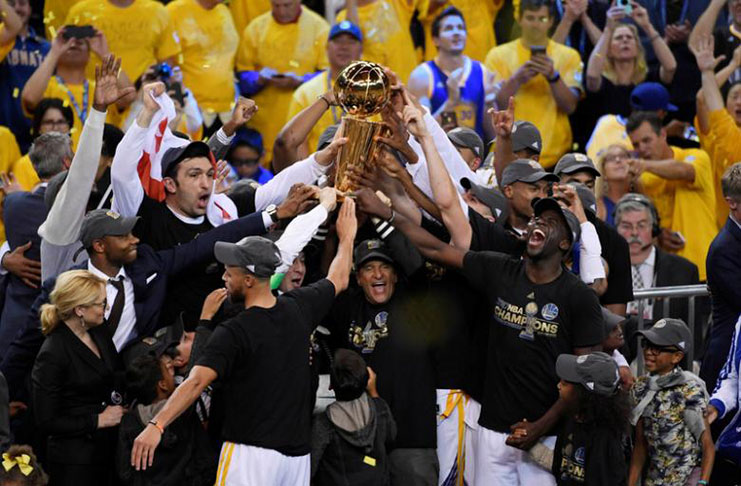 Golden State Warriors players and coaches celebrate with the Larry O'Brien Trophy after defeating the Cleveland Cavaliers in game five of the 2017 NBA Finals at Oracle Arena. (Mandatory Credit: Kyle Terada-USA TODAY Sports)