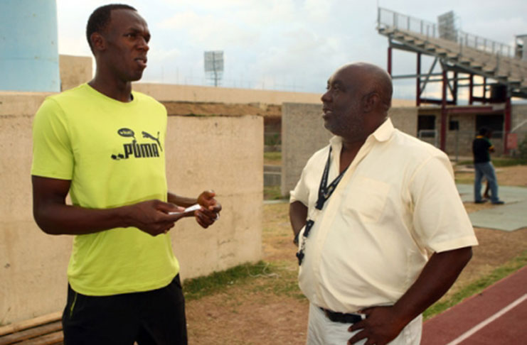 World’s fastest man Usain Bolt with his coach Glen Mills