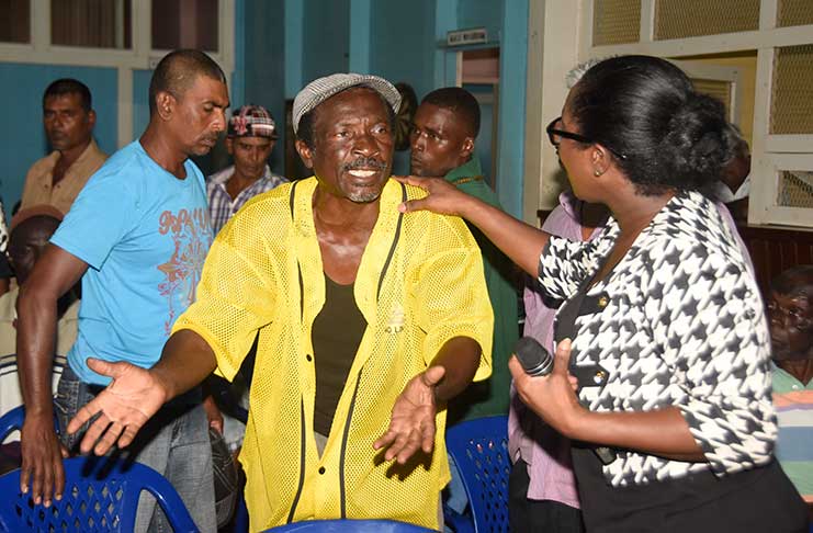 A passionate worker makes a point to GuySuCo Communications Officer Audreyanna Thomas at the Wales Community
Centre meeting on Thursday (Adrian Narine photo)