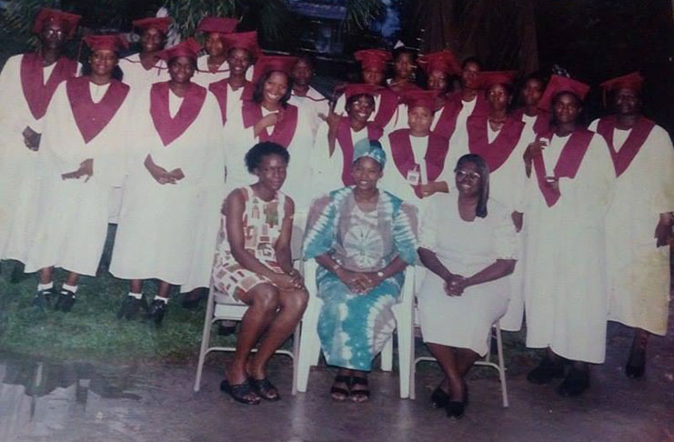 Ms Denise Gordon (seated centre) with some of her students who graduated from the institution