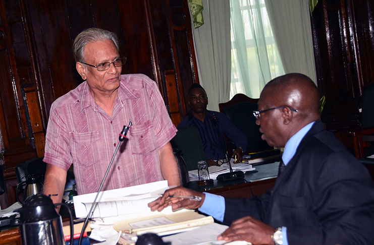 Minister of Public Service,
Dr Rupert Roopnaraine in
conversation with Clerk of the
National Assembly, Sherlock
Isaacs during last Thursday’s
sitting (Adrian Narine photo)