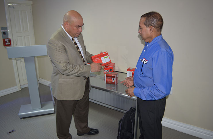 Regional Sales Manager, Orlando Mercado, highlighting one of the many features offered by the security products to President of STARR Computer, Michael Mohan.