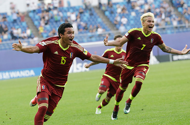 Venezuela's Samuel Sosa, left, celebrates after scoring a goal against Uruguay during a semi-final match in the FIFA U-20 World Cup Korea.