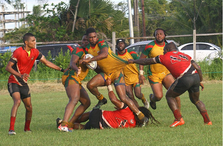 FLASHBACK! Guyana’s Claudius Butts in action against Trinidad and Tobago at St Stanislaus ground last month in the RAN 15s South Zone final. (Delano Williams photo)