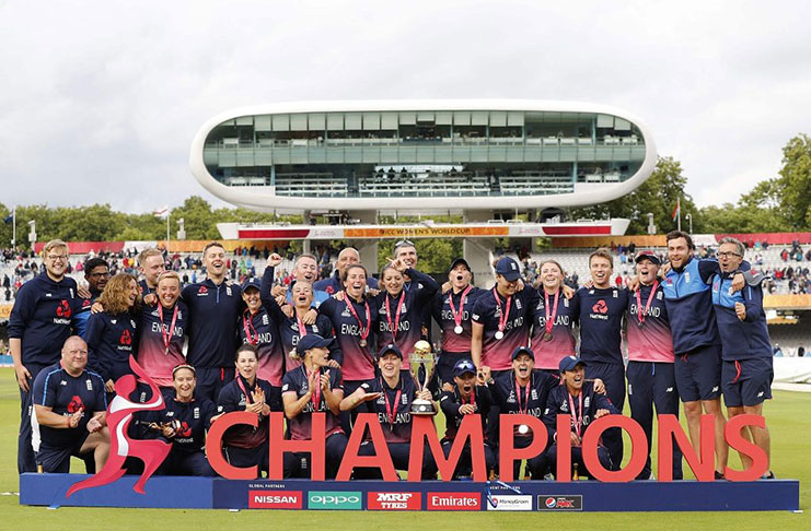 England players pose with the trophy after winning the ICC Women's World Cup cricket final between England and India at Lord's cricket ground in London on Sunday