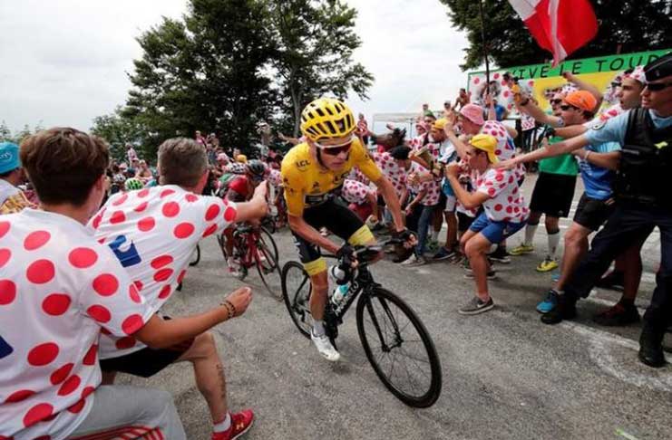 Team Sky rider and yellow jersey Chris Froome of Britain in action. REUTERS/Benoit Tessier