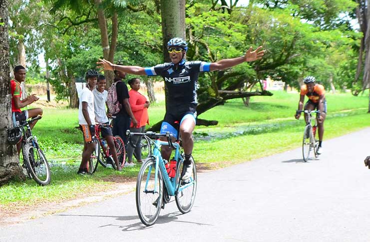 Guyana Police Force’s Mario King is unchallenged as he crosses the finish line to win the feature 35-lap event of the P&P Insurance Brokers sponsored 11-race cycle programme in the National Park yesterday.