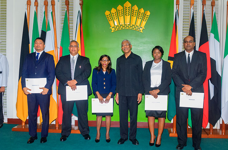 From left: Justice Gino Persaud, Justice Sandil Kissoon, Justice Simone Ramlall, President David Granger, Justice Damone Younge and Justice Rishi Persaud following the swearing-in ceremony on Wednesday at State House (Photo by Delano Williams)