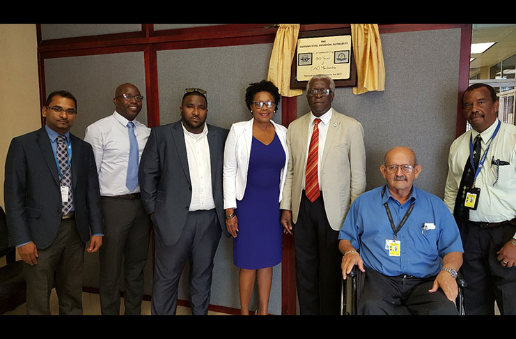 Director General of the GCAA Lt. Col. (Ret’d) Egbert Fields, with OAI CEO Mr. Anthony Mekdeci (seated) and LIAT’s CEO Ms. Julie Reifer-Jones, and other officials.