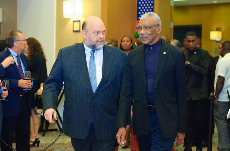 U.S. Ambassador to Guyana, Perry Holloway escorts, President David Granger into the main hall on arrival at the Guyana Marriott
for the U.S. 241st Independence celebration (Delano Williams photo)