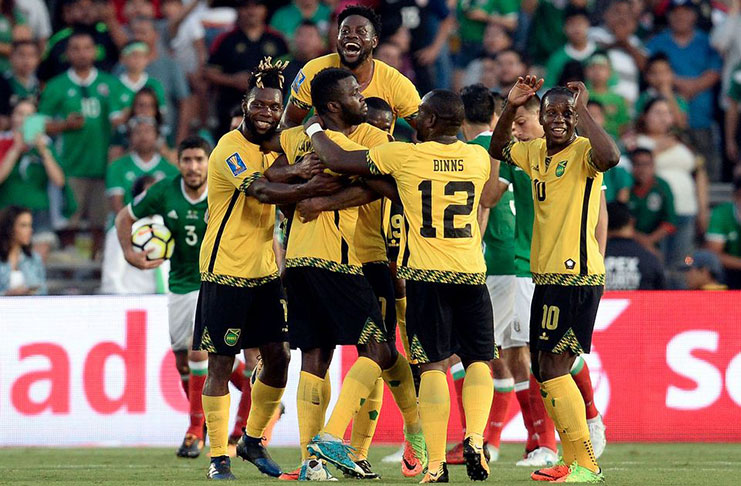 Jamaica’s Reggae Boyz celebrate Kemar Lawrence’s goal en route to their 1-0 victory over Mexico in Sunday’s semi-final of the CONCACAF Gold Cup.
