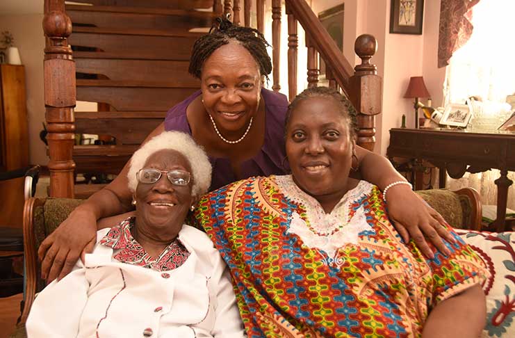 102-year-old Jean Smith, her daughter who is visiting Guyana with
her, Joy Okuefuna (seated at right) and a family friend, Jem Young