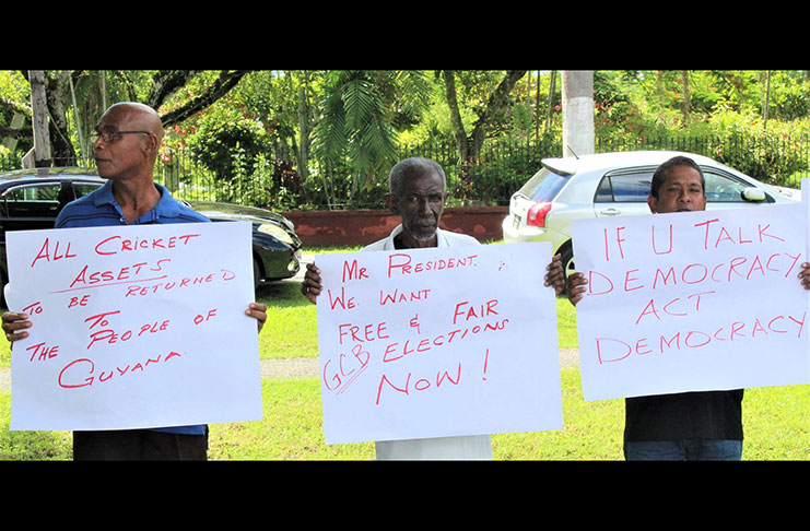 Protesters outside the Attorney General’s Chambers yesterday. (Photos compliments of the Newsroom)