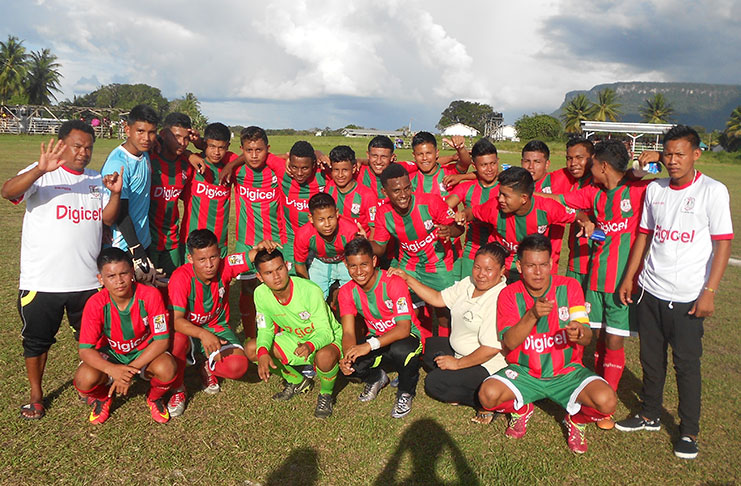 The victorious Waramadong team and head coach pose for a photo following their win over Paruima.