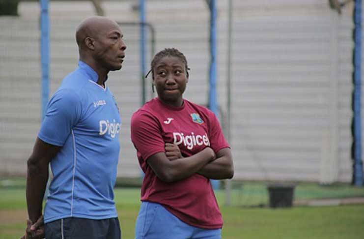 WORRYING TIMES: West Indies Women’s captain Stafanie Taylor (right) chats with head coach Vasbert Drakes during a training session on Saturday. (Photo courtesy CWI Media)