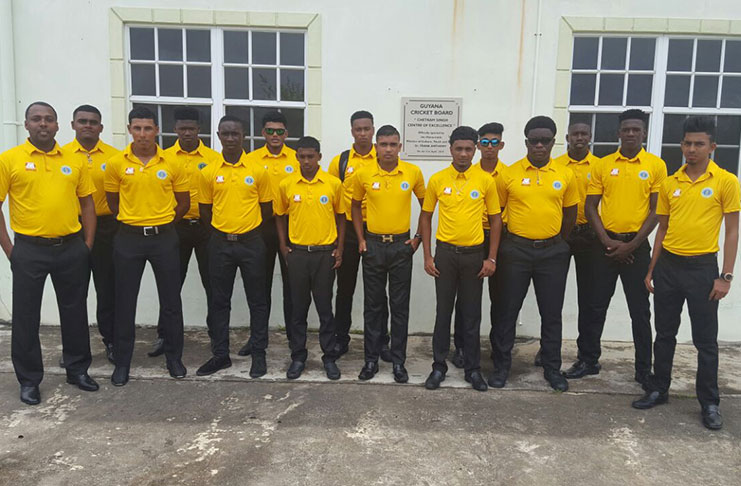 The National Under-19 squad and coach Julian Moore (extreme left) pose before departing the Chetram Singh Centre of Excellence hostel and indoor facility for the Eugene F. Correia International Airport. Manager/assistant coach Andy Ramnarine is absent.