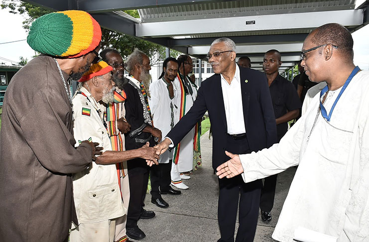President David Granger was greeted by members of the Reparation Committee and the Rastafarian Community upon his arrival at the University of Guyana's Turkeyen Campus