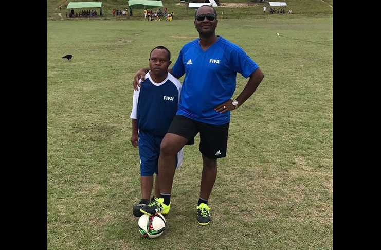 President of the GFF, Wayne Forde (right), and newly appointed Football Ambassador of the Village of Paramakatoi Andre Charles.