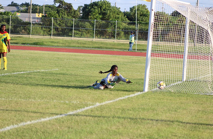 beaten! Guyana’s Indera Amardeo failed in her effort to stop the ball from crossing the goal line from an Elianne Sarmiento shot.