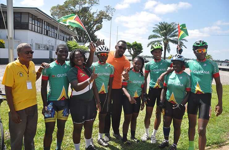 TEAM GUYANA! Director of Sport, Christopher Jones joins coach Hassan Mohammed and his team after retaining their IGG Cycling title  (Delano Williams photos)