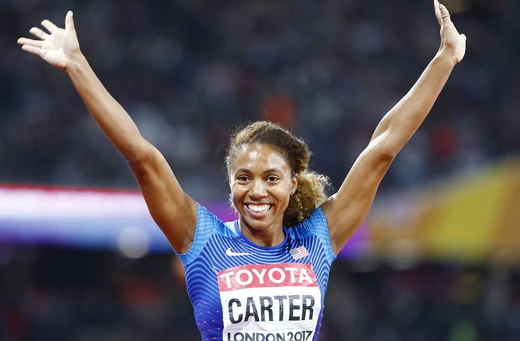 Kori Carter of the U.S. celebrates her 400 metres hurdles title.