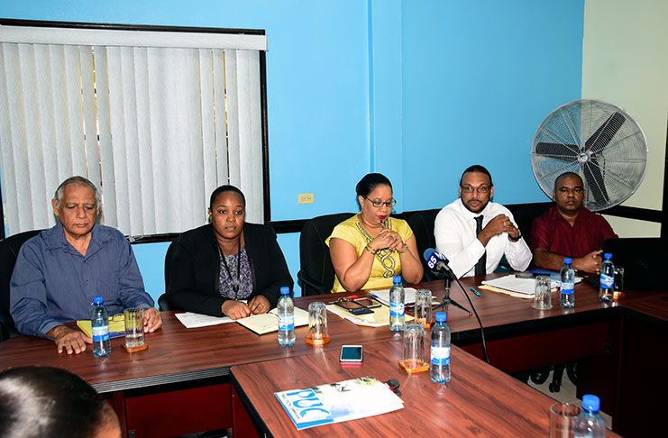 The leadership of the PUC. In the centre is the Chairman, Attorney-at-Law, Dela Britton. Secretary to the Commission, Vidiahar Persaud and Engineer, Nikita Somwaru are seated to her right, while Complaints Manager, Destra Bourne, and Head of Finance, Moorsalene Sankar, are seated to the left.