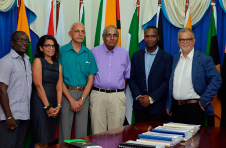 left to right) Minister of Communities Ronald Bulkan, Permanent Secretary (PS), Ministry of Communities, Emil Mc Garrel and Mayor of Bartica Gifford Marshall with the contractors.