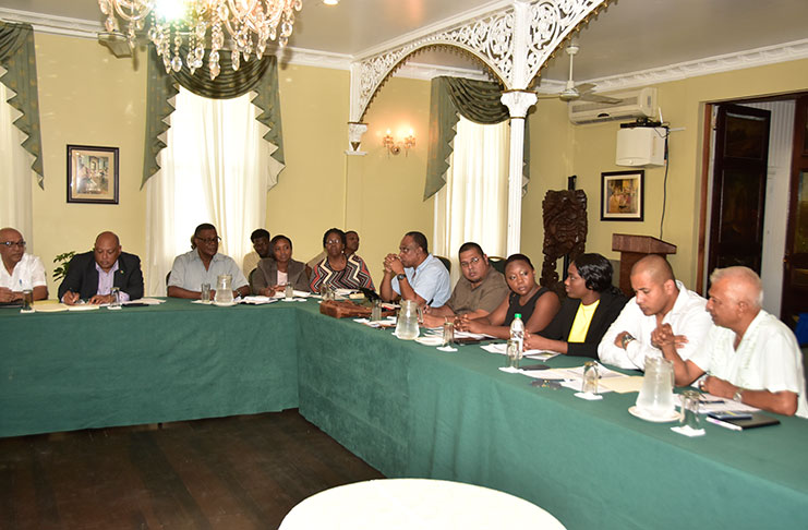 Stakeholders in the mining industry discussing their concerns on Thursday at Cara Lodge during the meeting.