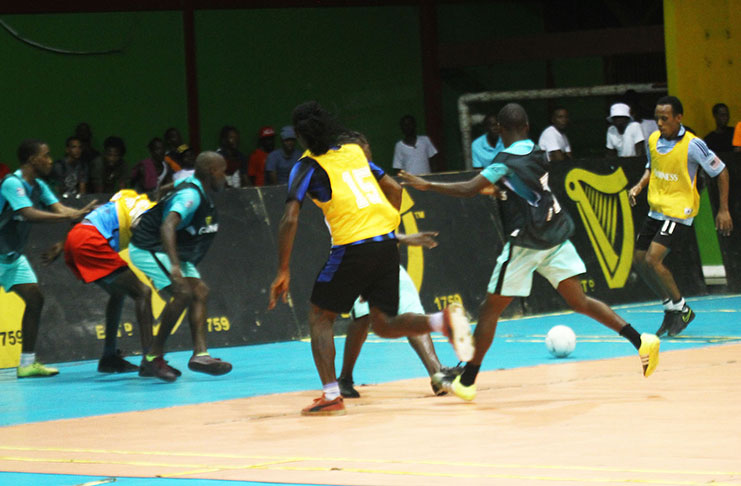 Quarter-final action in the inaugural Guinness Cage football tournament at the National Gymnasium.