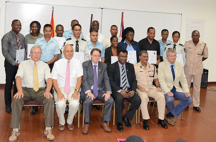 Seated from left are  the two British facilitators, Mr Paul Mathias and Mr Andy Odell; Deputy British High Commissioner, Ron Rimmer; Minister Khemraj Ramjattan; Commissioner of  Police (ag) David Ramnarine; Senior Security Sector Reform Advisor to the Ministry of the Presidency, Russell Combe, along with the certified police ranks of the training course. (Rabindra Rooplall Photo)