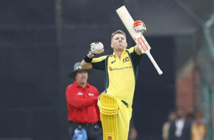 David Warner smashes a century in his 100th ODI as Australia at last picks up a victory over India in Bangalore.