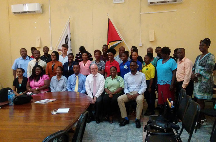 Linden Mayor, Carwyn Holland (fourth left) and Caribbean Development Bank (CDB), Country Economist for Guyana, Damion Reese (left of Holland) with youth leaders from Linden
